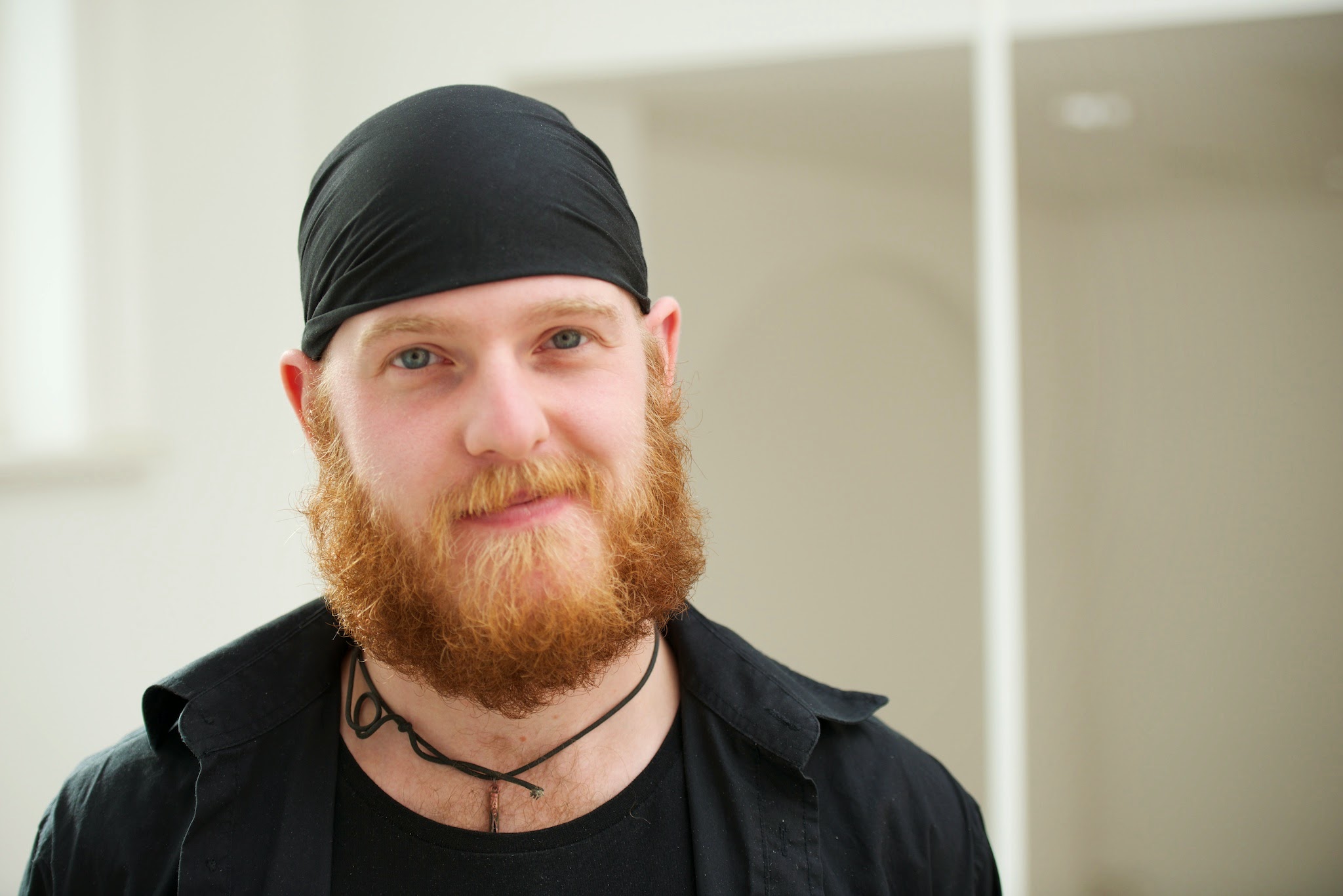Headshot of Matt Marshall, a red-headed bearded man wearing a skullcap